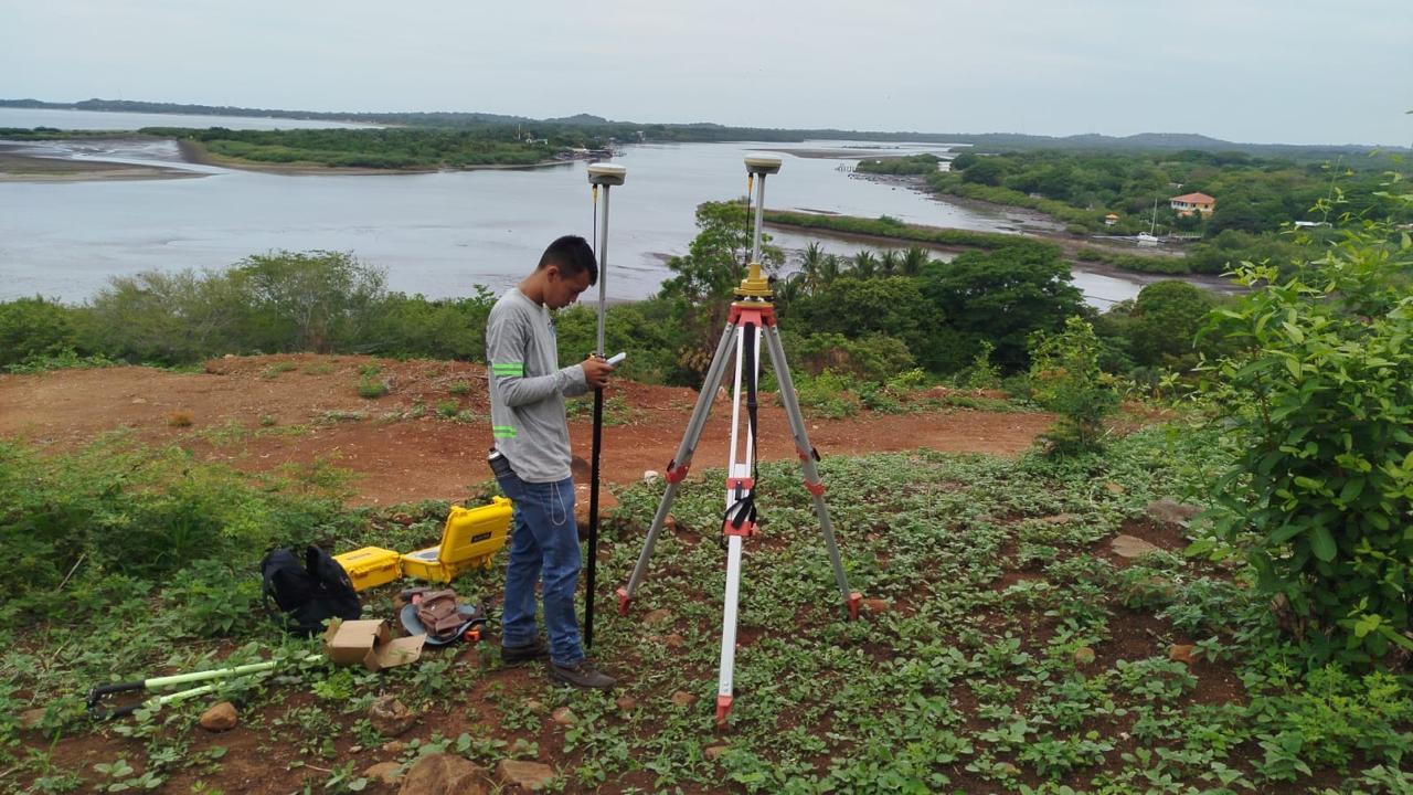 Survey crew working on the Paradise Bay site overlooking the water